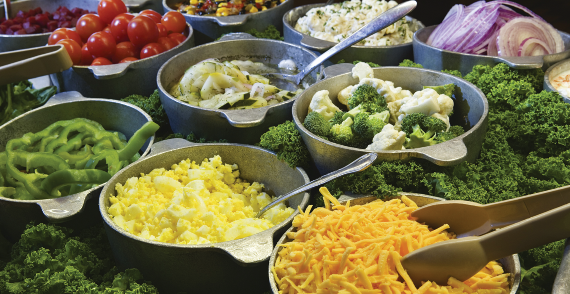 Elegant catering display featuring gourmet entrees and chafing dishes arranged for a formal event